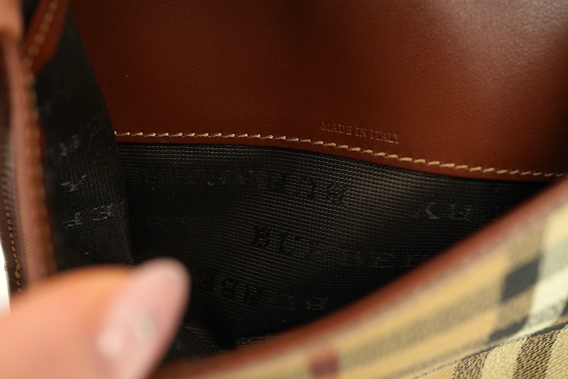 A Burberry brown tartan scarf, sunglasses with case and wallet with original box.